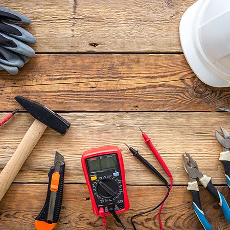 Electrical hand tools and a multimeter used for solar installation